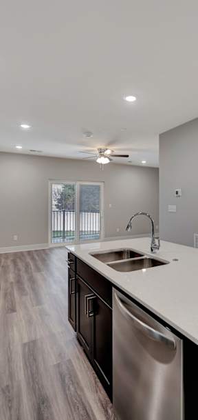 a kitchen with a sink and a mirror