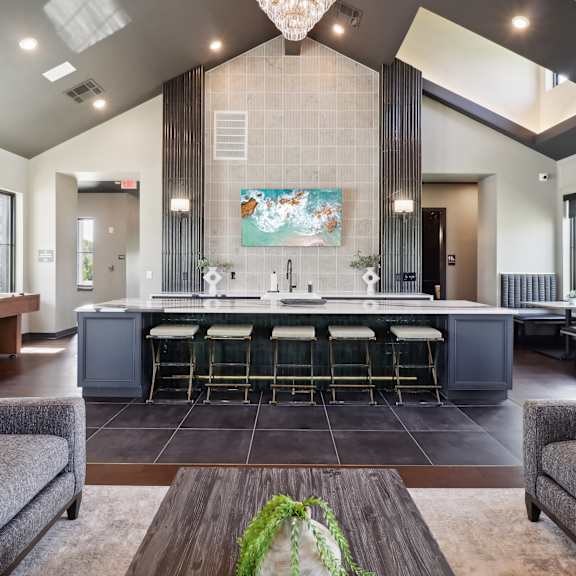 a clubhouse with a bar at The Depot in Raymore, MO 64083