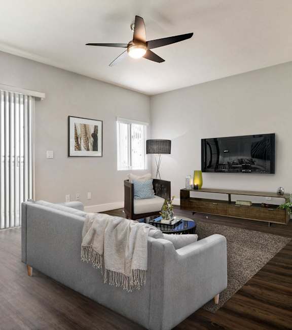 a living room with a tv at Metro, Los Angeles, CA