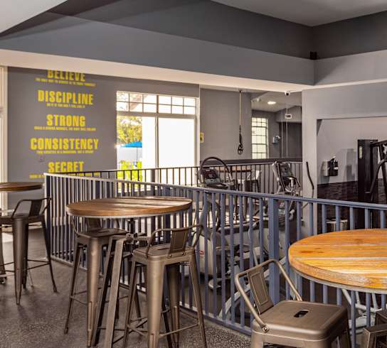 The fitness center, including tables and wall decals