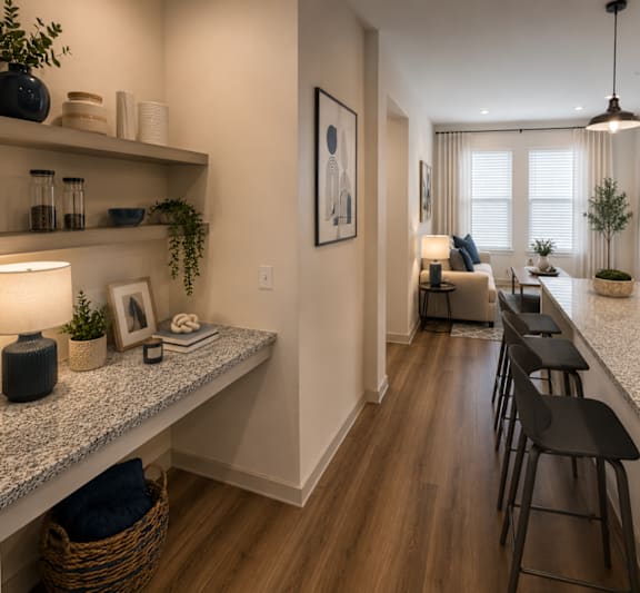 Entryway into the B1 apartment featuring breakfast bar and dining area