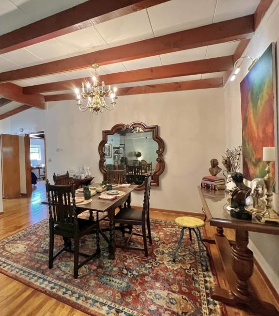a living room with a dining room table and a couch