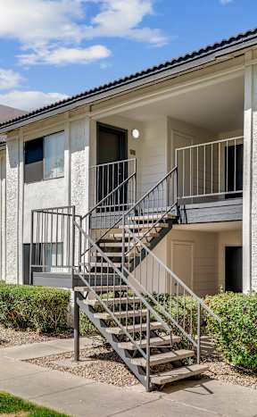 A building with a staircase leading to the entrance.at Solara, Phoenix, 85033