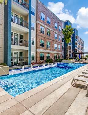Swimming Pool with lounge chairs at Republic at Alamo Heights, San Antonio, TX