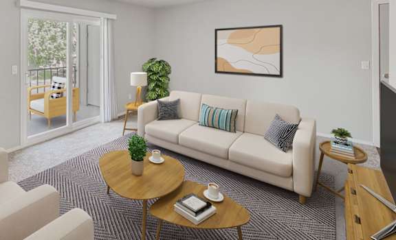 a living room with couches and a table at 2300 West Apartments, Reno, Nevada, 89502