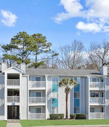 an apartment building with a parking lot in front of it  at Cape Landing, Myrtle Beach, 29588