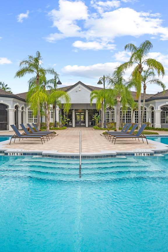 Pool Side Relaxing Area at The Grand Reserve at Tampa Palms Apartments, Tampa, Florida