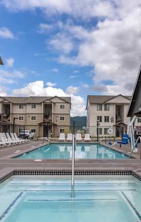 A spacious gym with a variety of equipment including treadmills, weights, and exercise machines at Marcola Apartment Homes, Forest Grove, OR, 97477