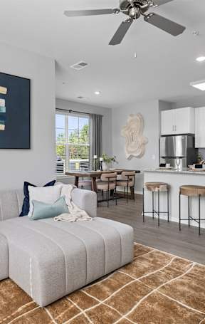 a living room and dining room with a couch and a table