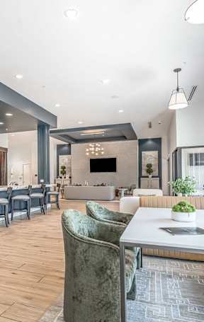 A living room with a blue couch and a coffee table.