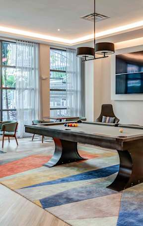 a living room and dining room with a couch and a table