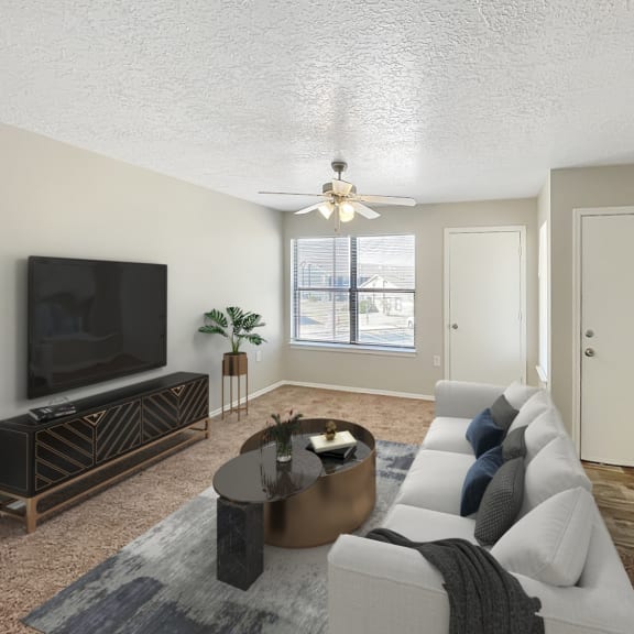 an open living room with a couch and a tv