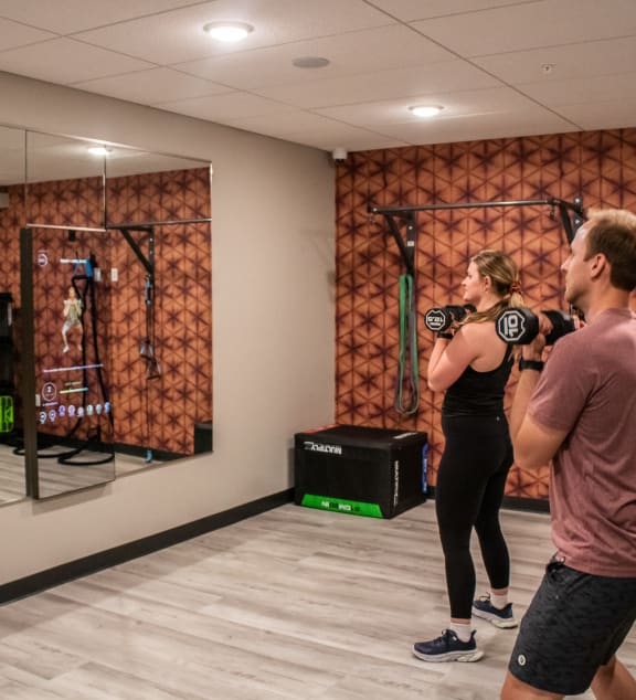 people working out in front of a mirror in the gym at Vue at Bluestone, Duluth, Minnesota