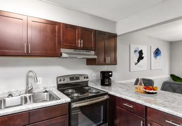 Kitchen with Modern Fixtures at South Square Townhomes, Durham, 27707