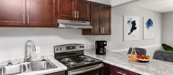 Kitchen with Modern Fixtures at South Square Townhomes, Durham, 27707