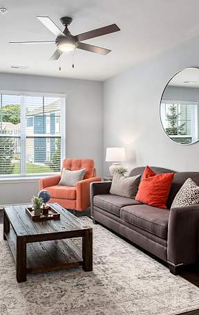 a living room and dining room with a couch and a table
