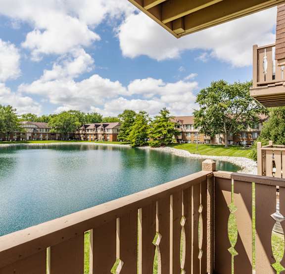 A view from a balcony overlooking a lake at Bavarian Village Apartments, Indianapolis, IN, 46235