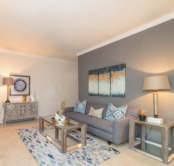 a living room with a couch and a fireplace at High Oaks, Austin, 78759