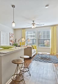 Modern Living Room with wood floors at Tattersall Chesapeake, Virginia
