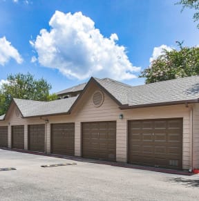 a brown garage with a row of garage doors