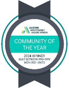 An award badge for the Community of the Year from the Austin Apartment Association.