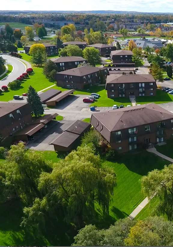 an aerial view of a neighborhood with houses and buildings