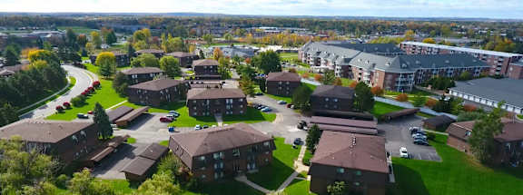 an aerial view of a neighborhood with houses and buildings