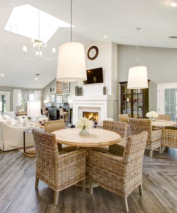 a kitchen with stainless steel appliances and white cabinets