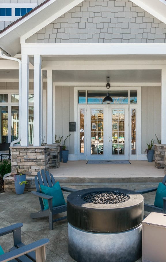 a patio with chairs and a fire pit in front of a house at Village at Westland Cove Apartments, Knoxville, TN, 37922