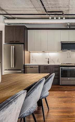 a kitchen and dining area in a 555 waverly unit