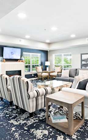 a living room and dining room with a couch and a table