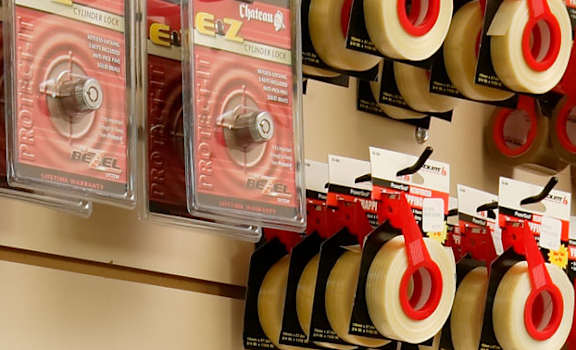A store display of moving kits with a sign offering 15% off.