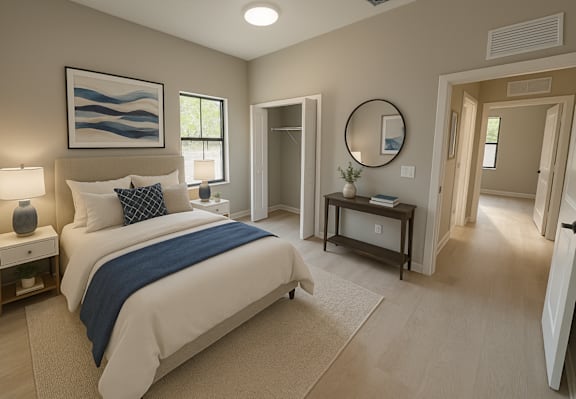 A bedroom with a large bed and a painting on the wall.