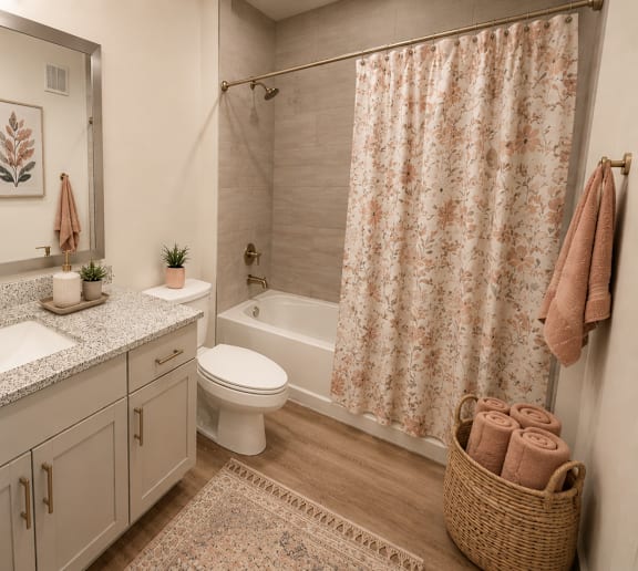 Stylish apartment bathroom with modern vanity and bathtub at The Westerly Apartments in Midlothian