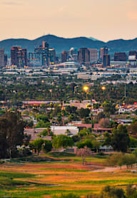 a view of the city at dusk at Connect on Northern Apartments, Glendale 85301