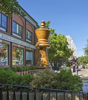 a giant golden trophy in the middle of a street