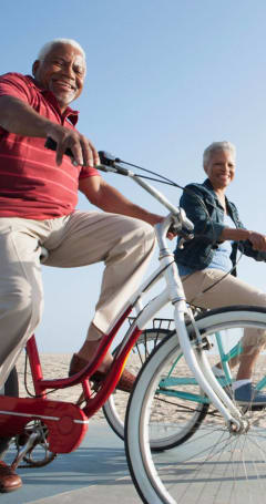 Resident enjoying a bike ride at the beach