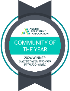 An award badge for the Community of the Year from the Austin Apartment Association.