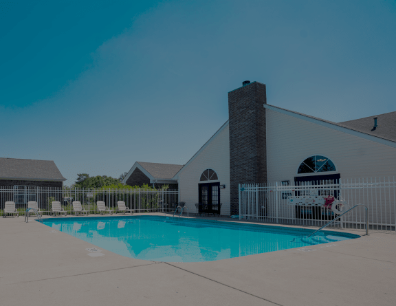 our resort style swimming pool is next to our building with lounge chairs