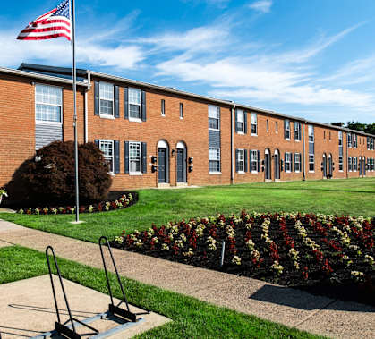 a brick building with an flag in front of it