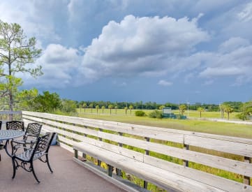 Outdoor Seating with Green Views at River Crossing Apartments, Thunderbolt, GA 31404