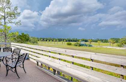 Outdoor Seating with Green Views at River Crossing Apartments, Thunderbolt, GA 31404