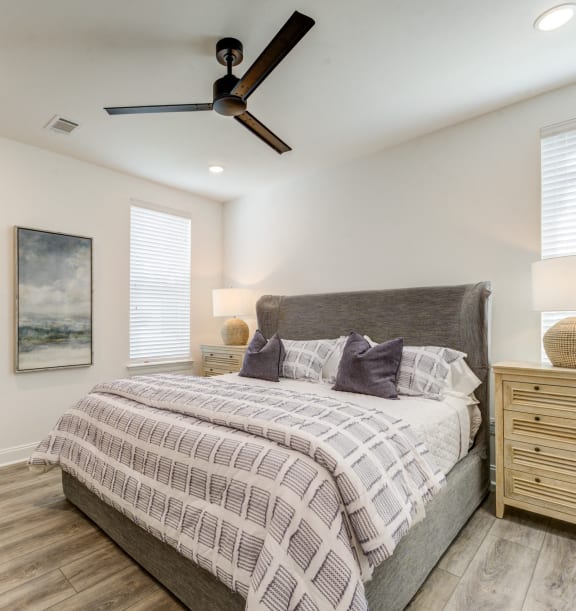 a bedroom with a bed and a ceiling fan at Residences at 393 North Apartments, Santa Rosa Beach, Florida