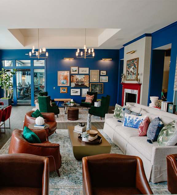 A living room with a white couch and a coffee table.