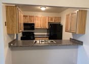 Thumbnail 8 of 16 - Kitchen Franklin North Apartments 300 Riverwind Dr Dewitt, MI 48820