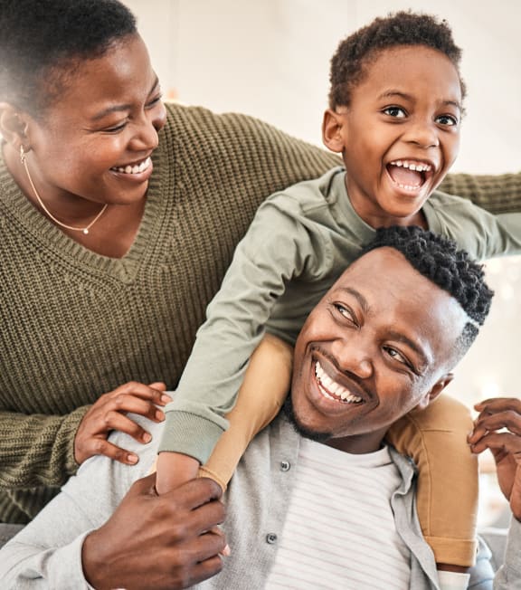 a man is holding a child on top of his shoulders