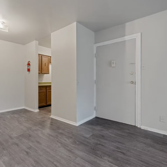 A room with a grey floor and white walls.