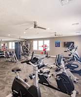 the gym at swiftwater apartments filled with exercise equipment