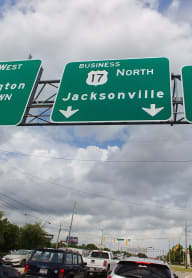 a highway sign that reads west wimbledon north jacksonsville east and wrights
