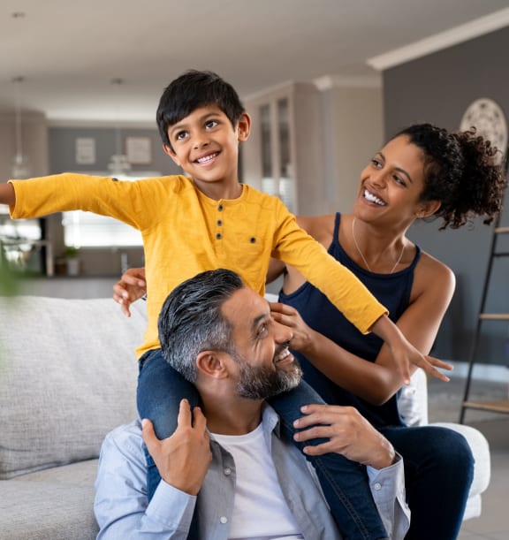 Family Sitting on a Couch at Refinery Row in Baltimore, 21224